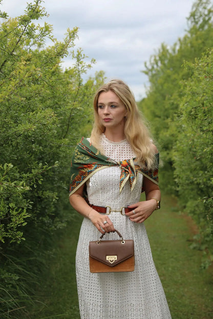 Detailed close-up of the sand-cast solid brass stirrup design hook and loop fastening on our equestrian belt.