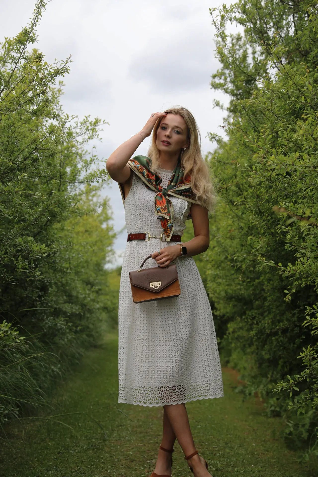 The Filly & Fox women's equestrian belt in classic bridle leather, shown with brass stirrup hardware. Hannah Smith 