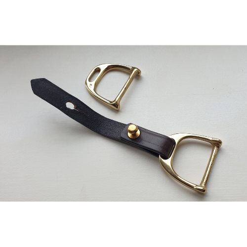 Woman styling silk scarf as waist belt using brass and leather scarf belt tie
